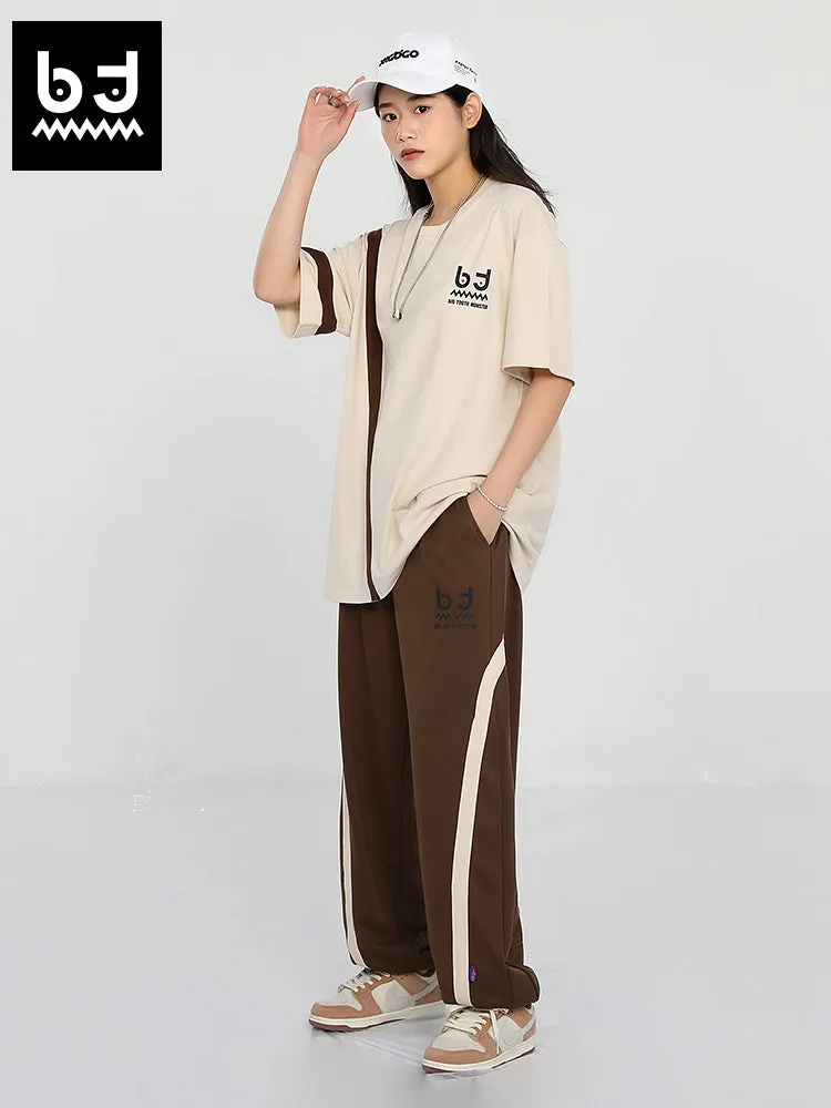 Simple casual style striped ribbon print loose leg drawstring sports pants