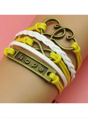 Yellow Leather charm bracelet with bronze colored charms, hope, double heart, and infinity